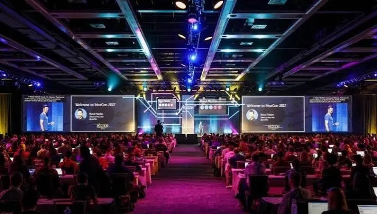 Brand launch event at convention hall with stage lighting